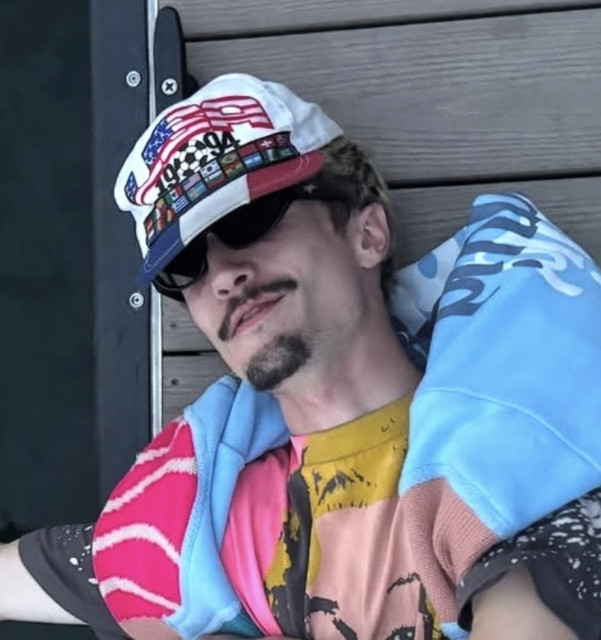 Johnny Rapp in a colorful jacket and cap